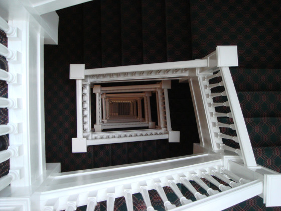 Looking down (way down) the staircase at HI's City Center Hostel (photo by Rachel)