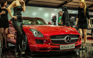 Hot cars, wealth, and beautiful young women go together like bread and butter, marketers have always believed. (photo by Mustafa Khayat)